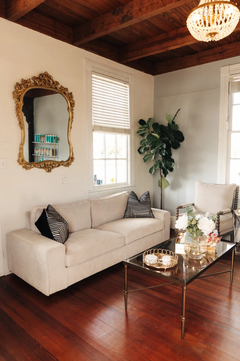 The salon lounge with a vintage gilded mirror and warm light